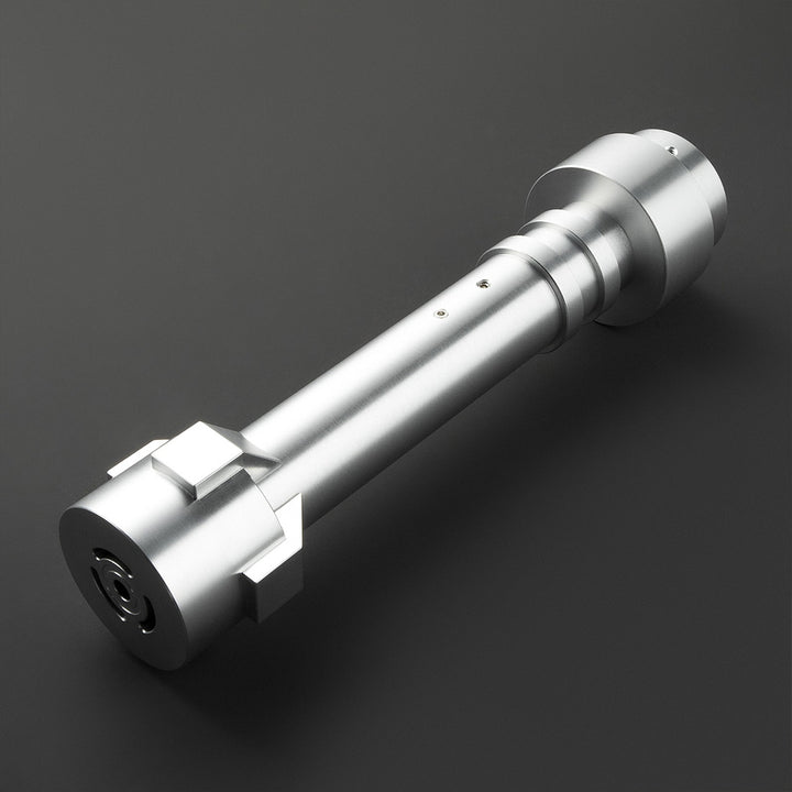 Metallic tool or component on a dark background